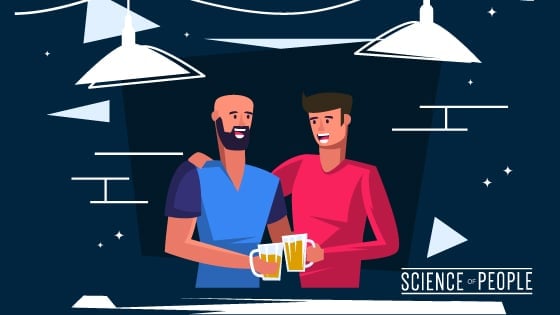 2 people, drinking beer, having fun and chatting with each other at a Social Event